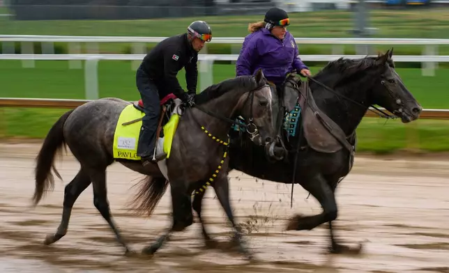 Kentucky Derby entrant Pavlovian works out at Churchill Downs Wednesday, April 29, 2026, in Louisville, Ky. (AP Photo/Charlie Riedel)