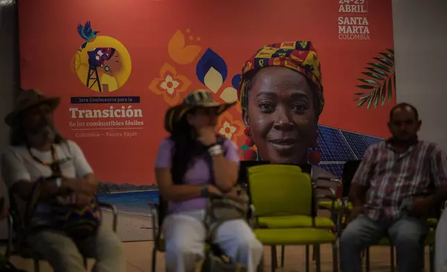 People attend a session during a conference aimed at transitioning away from fossil fuels Monday, April 27, 2026, in Santa Marta, Colombia. (AP Photo/Ivan Valencia)