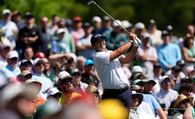 Patrick Reed watches his tee shot on the 12th hole during a practice round ahead of the Masters golf tournament at the Augusta National Golf Club, Tuesday, April 7, 2026, in Augusta, Ga. (AP Photo/David J. Phillip)