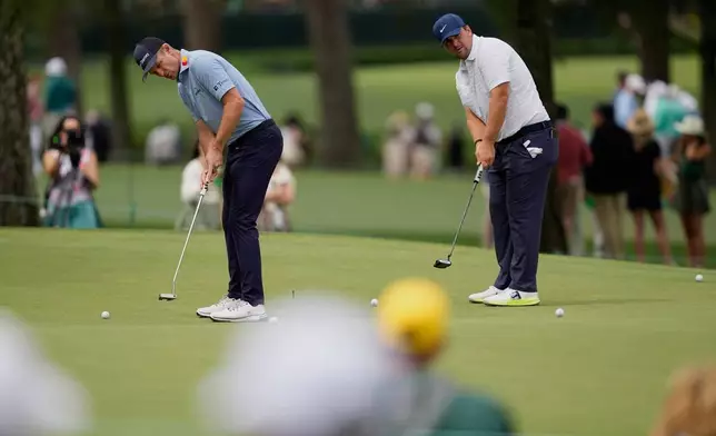 Justin Rose, of England, and Chris Gotterup putt on the seventh hole during a practice round ahead of the Masters golf tournament at the Augusta National Golf Club, Monday, April 6, 2026, in Augusta, Ga. (AP Photo/Ashley Landis)