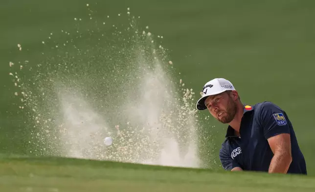 Sam Burns hits from the bunker on the sixth hole during a practice round ahead of the Masters golf tournament at the Augusta National Golf Club, Tuesday, April 7, 2026, in Augusta, Ga. (AP Photo/Matt Slocum)