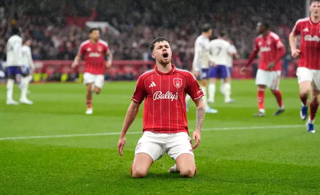 Nottingham Forest's Neco Williams celebrates scoring their side's first goal of the game during the Premier League soccer match between Nottingham Forest and Aston Villa, in Nottingham, England, Sunday April 12, 2026. (Nick Potts/PA via AP)