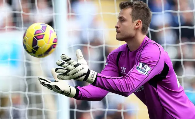 FILE - Liverpool's goalkeeper Simon Mignolet catches the ball during their English Premier League soccer match against Newcastle United at St James' Park, Newcastle, England, Nov. 1, 2014. (AP Photo/Scott Heppell, File)