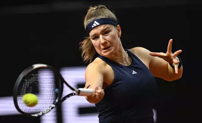 Czech Republic's Karolina Muchova returns a shot to Kazakhstan's Elena Rybakina, during the women's final match at the Stuttgart Open tennis tournament, in Stuttgart, Germany, Sunday, April 19, 2026. (Marijan Murat/dpa via AP) CORRECTION:name corrected to Elena instead of Jelena