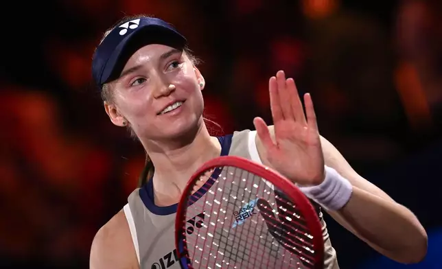 Kazakhstan's Elena Rybakina celebrates winning the women's final match against Czech Republic's Karolina Muchova at the Stuttgart Open tennis tournament, in Stuttgart, Germany, Sunday, April 19, 2026. (Marijan Murat/dpa via AP) CORRECTION. name corrected to Elena instead of Jelena