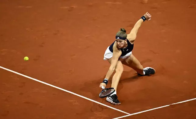 Czech Republic's Karolina Muchova returns a shot to Kazakhstan's Elena Rybakina, during the women's final match at the Stuttgart Open tennis tournament, in Stuttgart, Germany, Sunday, April 19, 2026. (Marijan Murat/dpa via AP) CORRECTION:name corrected to Elena instead of Jelena