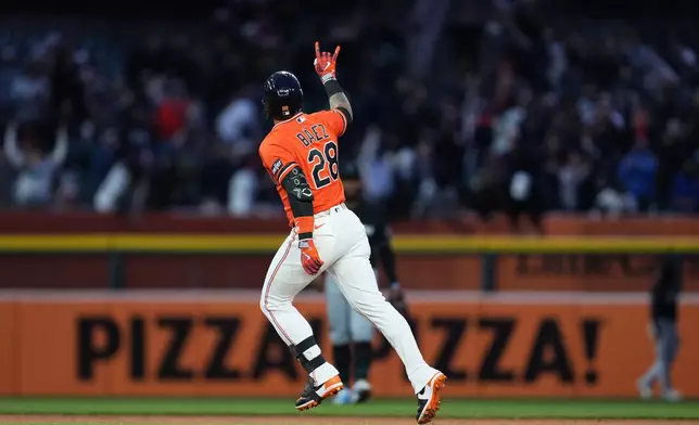 Detroit Tigers' Javier Báez celebrates his home run against the Miami Marlins during the fifth inning of a baseball game Friday, April 10, 2026, in Detroit. (AP Photo/Paul Sancya)