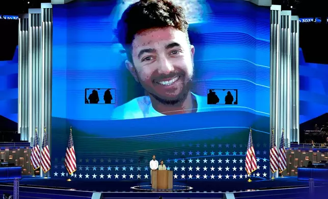 FILE - Jon Polin, left, and Rachel Goldberg, parents of Hersh Goldberg-Polin, pictured on screen speak during the Democratic National Convention Wednesday, Aug. 21, 2024, in Chicago. (AP Photo/J. Scott Applewhite, File)
