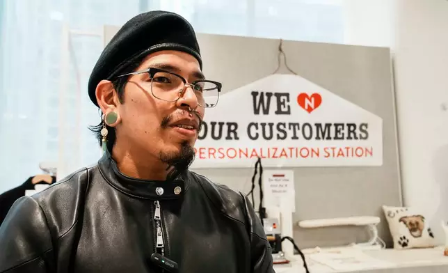 Tailor Marco Lema, 35, of Ecuador, speaks during an interview at Nordstrom headquarters in New York, Monday, March 23, 2026. (AP Photo/Eduardo Munoz Alvarez)