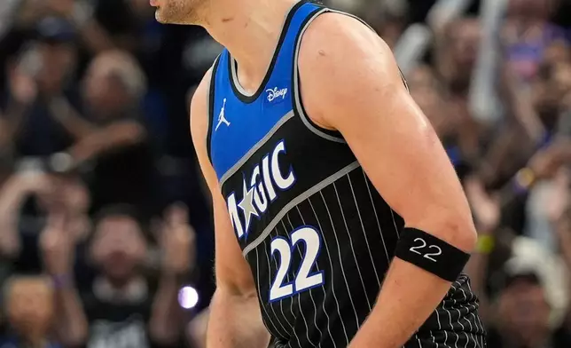Orlando Magic forward Franz Wagner (22) celebrates after making a 3-point shot against the Detroit Pistons during the second half in Game 3 of a first-round NBA basketball playoff series, Saturday, April 25, 2026, in Orlando, Fla. (AP Photo/John Raoux)