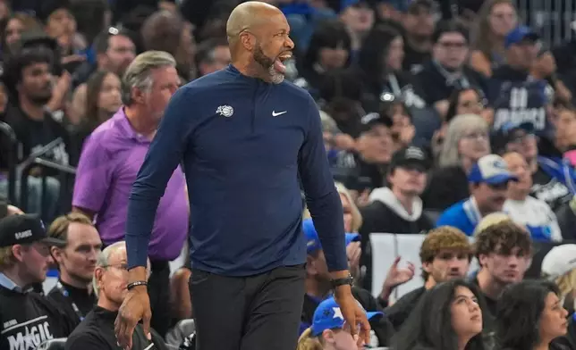 Orlando Magic head coach Jamahl Mosley shouts to players during the second half in Game 3 of a first-round NBA basketball playoff series against the Detroit Pistons, Saturday, April 25, 2026, in Orlando, Fla. (AP Photo/John Raoux)