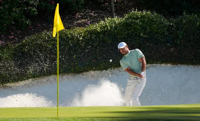 Brooks Koepka hits from the bunker on the 12th hole during the first round of the Masters golf tournament at the Augusta National Golf Club, Thursday, April 9, 2026, in Augusta, Ga. (AP Photo/Eric Gay)