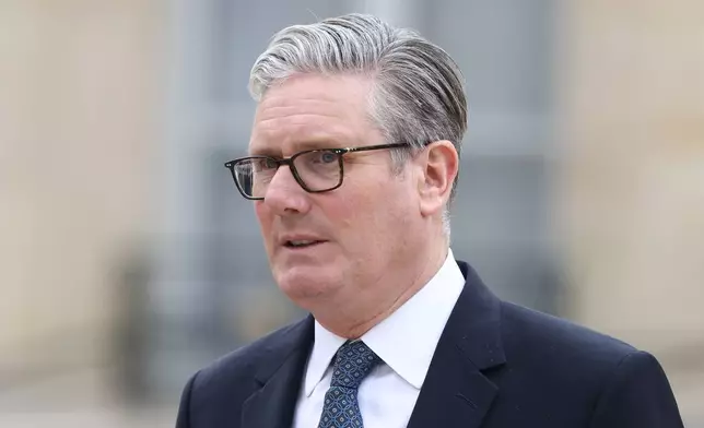 British Prime Minister Keir Starmer leaves after the multinational virtual summit and press conference at the Elysee Presidential Palace in Paris, Friday April 17, 2026 (Tom Nicholson/Pool Photo via AP)
