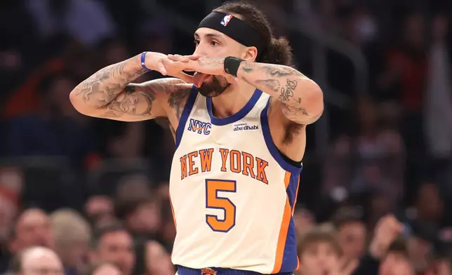 New York Knicks' Jose Alvarado (5) reacts after scoring a three-point basket during the first half of an NBA basketball game against the Charlotte Hornets, Sunday, April 12, 2026, in New York. (AP Photo/Pamela Smith)