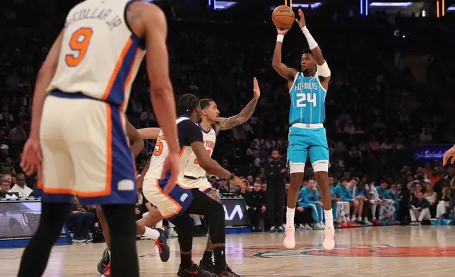 Charlotte Hornets' Brandon Miller (24) goes up to shoot during the first half of an NBA basketball game against the New York Knicks, Sunday, April 12, 2026, in New York. (AP Photo/Pamela Smith)