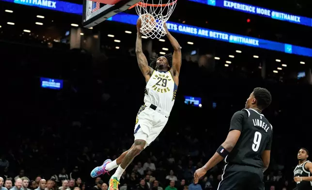 Indiana Pacers guard Quenton Jackson (29) dunks during the first half of an NBA basketball game against Brooklyn Nets, Thursday, April 9, 2026, in New York. (AP Photo/Yuki Iwamura)