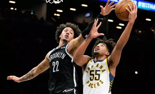 Indiana Pacers guard Ethan Thompson (55) shoots over Brooklyn Nets forward Jalen Wilson (22) during the first half of an NBA basketball game, Thursday, April 9, 2026, in New York. (AP Photo/Yuki Iwamura)
