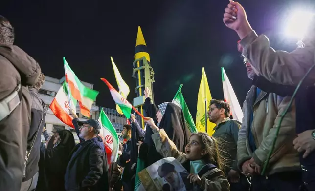 A ballistic missile is displayed by Iran's Revolutionary Guard during a pro-government demonstration at Enqelab-e-Eslami (Islamic Revolution) Square in downtown Tehran, Iran, Tuesday, April 21, 2026. (Alireza Masoumi/ISNA via AP)