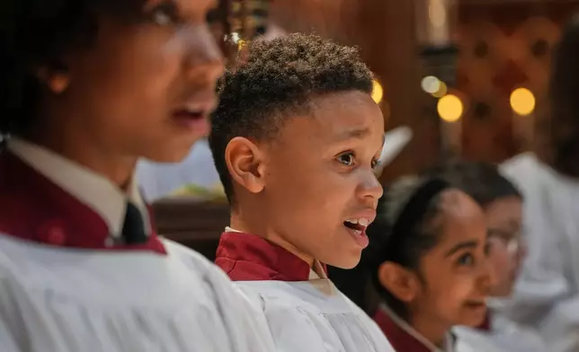 Britain Choral Music Choristers sing during Evensong at Rochester Cathedral in Rochester, England, Friday, March 27, 2026. (AP Photo/Kin Cheung)
