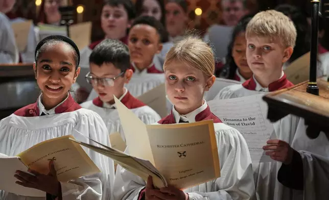 Britain Choral Music Choristers sing during Evensong at Rochester Cathedral in Rochester, England, Friday, March 27, 2026. (AP Photo/Kin Cheung)