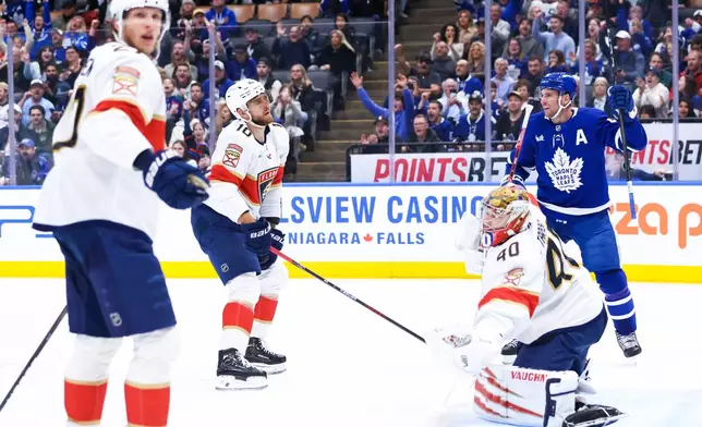 Toronto Maple Leafs' John Tavares (91) celebrates a goal on Florida Panthers goaltender Daniil Tarasov (40) during second period NHL action in Toronto on Saturday, April 11, 2026. (Cole Burston/The Canadian Press via AP)