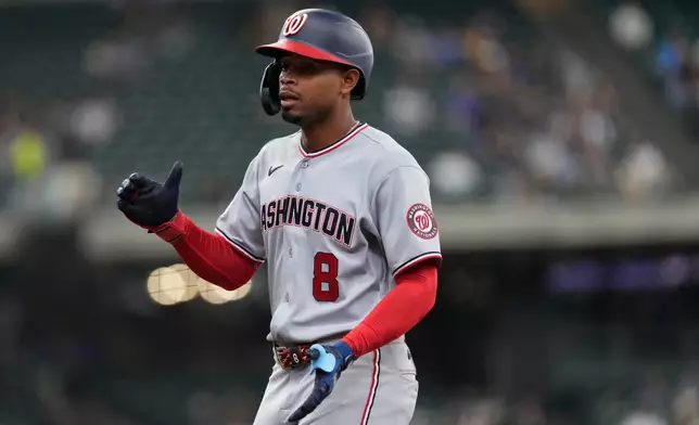 Washington Nationals' José Tena claps after hitting an RBI single during the seventh inning of a baseball game against the Milwaukee Brewers, Sunday, April 12, 2026, in Milwaukee. (AP Photo/Aaron Gash)