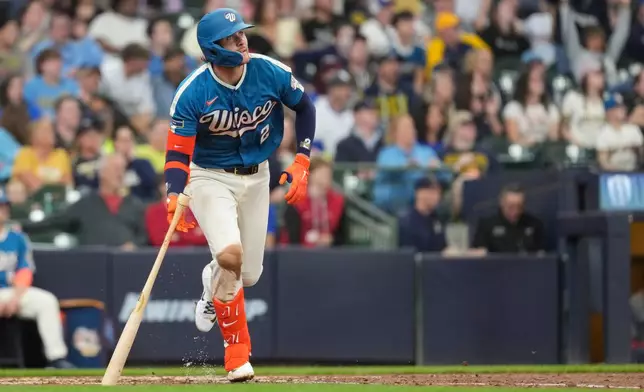 Milwaukee Brewers' Brice Turang watches his solo home run during the fifth inning of a baseball game against the Washington Nationals, Sunday, April 12, 2026, in Milwaukee. (AP Photo/Aaron Gash)