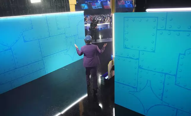 Ohio State defensive back Caleb Downs walks on stage after being chosen by the Dallas Cowboys with the 11th overall pick during the first round of the NFL football draft, Thursday, April 23, 2026, in Pittsburgh. (AP Photo/Jeff Roberson)