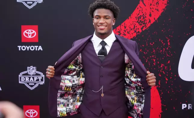 Ohio State defensive back Caleb Downs poses on the red carpet before the first round of the NFL football draft, Thursday, April 23, 2026, in Pittsburgh. (AP Photo/Gene J. Puskar)