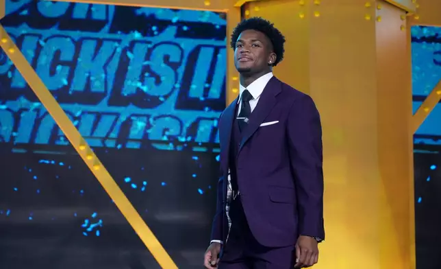 Ohio State defensive back Caleb Downs walks on stage before the first round of the NFL football draft, Thursday, April 23, 2026, in Pittsburgh. (AP Photo/Gene J. Puskar)