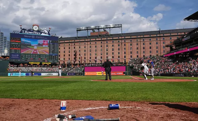 A called ball is overturned through the Automated Ball-Strike system, resulting in a win for the Baltimore Orioles over the Texas Rangers in the ninth inning of a baseball game, Wednesday, April 1, 2026, in Baltimore. (AP Photo/Stephanie Scarbrough)
