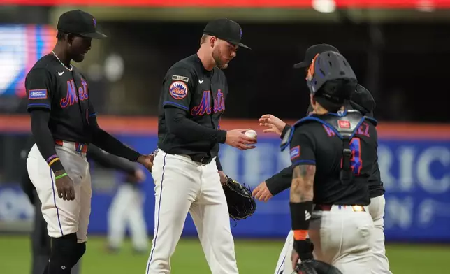 New York Mets starting pitcher Christian Scott, center, leaves during the second inning of a baseball game against the Minnesota Twins Thursday, April 23, 2026, in New York. (AP Photo/Frank Franklin II)