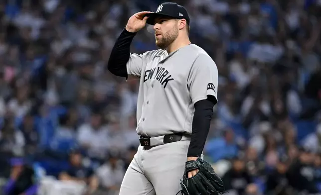 New York Yankees pitcher David Bednar reacts after the Tampa Bay Rays tie the game during the tenth inning of a baseball game Saturday, April 11, 2026, in St. Petersburg, Fla. (AP Photo/Jason Behnken)