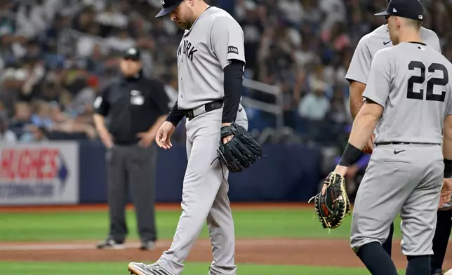 New York Yankees pitcher David Bednar reacts after the Tampa Bay Rays tie the game during the tenth inning of a baseball game Saturday, April 11, 2026, in St. Petersburg, Fla. (AP Photo/Jason Behnken)