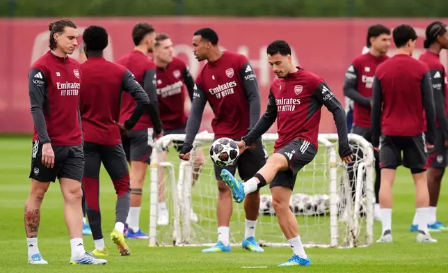 Arsenal's Riccardo Calafiori, left, and Gabriel Martinelli during a training session in London, Tuesday, April 28, 2026. (John Walton/PA via AP)