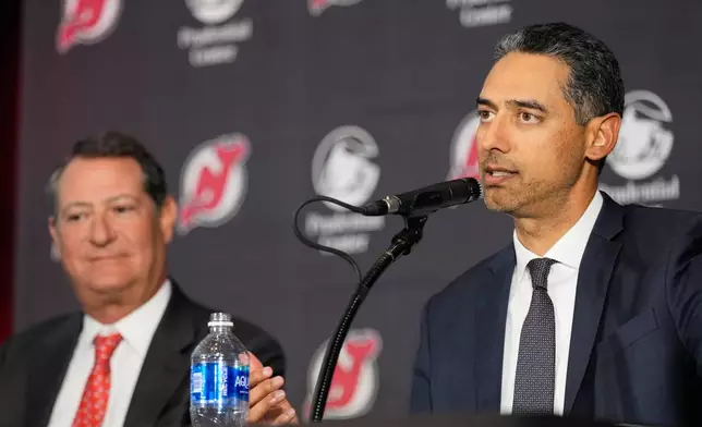 Sunny Mehta, the new general manager of the New Jersey Devils NHL hockey club, speaks during an introductory news conference in Newark, N.J., Tuesday, April 21, 2026. (AP Photo/Seth Wenig)