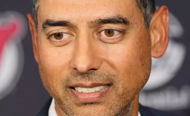 Sunny Mehta, the new general manager of the New Jersey Devils NHL hockey club, attends news conference in Newark, N.J., Tuesday, April 21, 2026. (AP Photo/Seth Wenig)