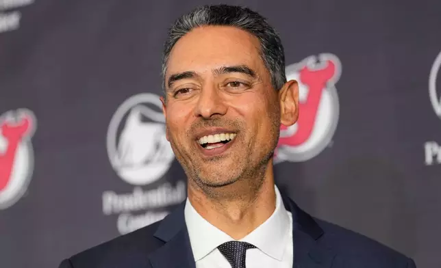 Sunny Mehta, the new general manager of the New Jersey Devils NHL hockey club, attends news conference in Newark, N.J., Tuesday, April 21, 2026. (AP Photo/Seth Wenig)