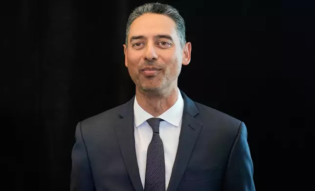 Sunny Mehta, the new general manager of the New Jersey Devils NHL hockey club, attends news conference in Newark, N.J., Tuesday, April 21, 2026. (AP Photo/Seth Wenig)