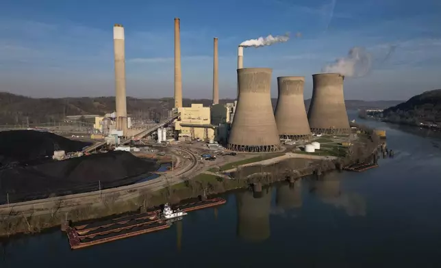 American Electric Power's John Amos coal-fired power plant in Winfield, W.Va., stands across the Kanawha River, Sunday, March 22, 2026. (AP Photo/Carolyn Kaster)