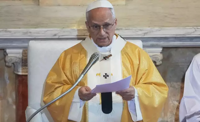 Pope Leo XIV delivers his speech as he celebrates a Mass in the Saint Augustine Basilica in Annaba, Algeria, Tuesday, April 14, 2026, on the second day of an 11-day apostolic journey to Africa. (AP Photo/Andrew Medichini)
