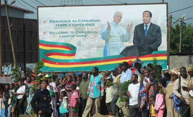 People greet Pope Leo XIV upon his arrival in Yaounde, Cameroon, Wednesday, April 15, 2026, on the third day of an 11-day apostolic journey to Africa. (AP Photo/Andrew Medichini)