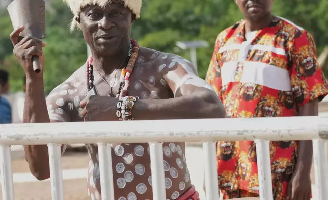 People greet Pope Leo XIV upon his arrival in Yaounde, Cameroon, Wednesday, April 15, 2026, on the third day of an 11-day apostolic journey to Africa. (AP Photo/Andrew Medichini)