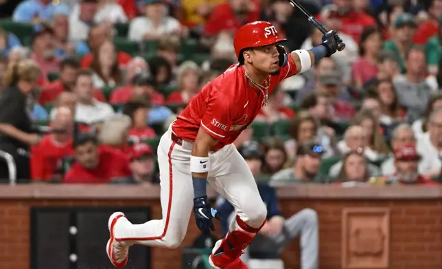 St. Louis Cardinals' Masyn Winn watches his two-run RBI single against the Seattle Mariners during the fourth inning of a baseball game, Friday, April 24, 2026, in St. Louis. (AP Photo/Jeff Le)