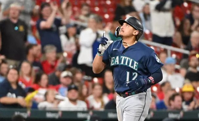 Seattle Mariners' Josh Naylor reacts after hitting a home run against the St. Louis Cardinals during the sixth inning of a baseball game, Friday, April 24, 2026, in St. Louis. (AP Photo/Jeff Le)