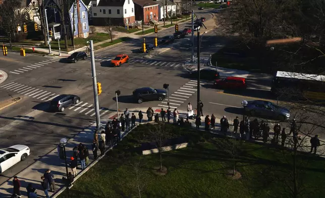 Students and other attendees wait in line before a campaign event with streamer Hasan Piker and Abdul El-Sayed, a progressive candidate in the Democratic primary for U.S. Senate in Michigan, Tuesday, April 7, 2026, at the University of Michigan in Ann Arbor, Mich. (AP Photo/Julia Demaree Nikhinson)