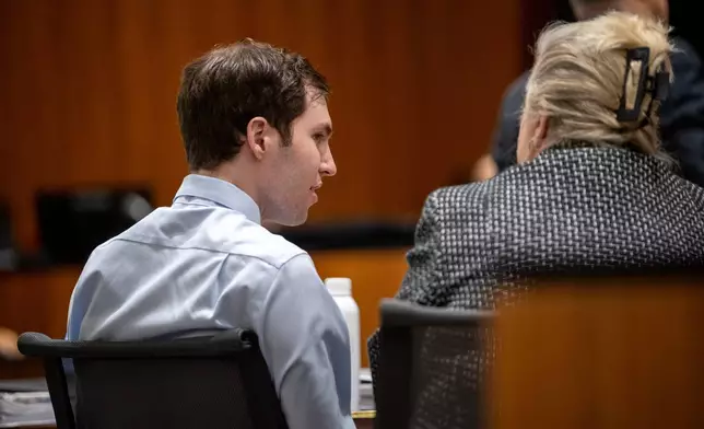 Tyler Robinson, left, speaks with his attorney Kathryn Nester in 4th District Court in Provo, Utah, on Friday, April 17, 2026. (Trent Nelson/The Salt Lake Tribune via AP, Pool)