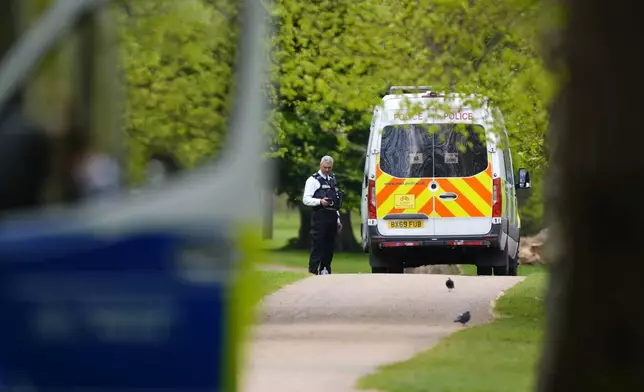 Police are seen inspecting an area in Kensington Gardens, near the Israeli Embassy, in London, Friday, April 17, 2026. (Jordan Pettitt/PA via AP)