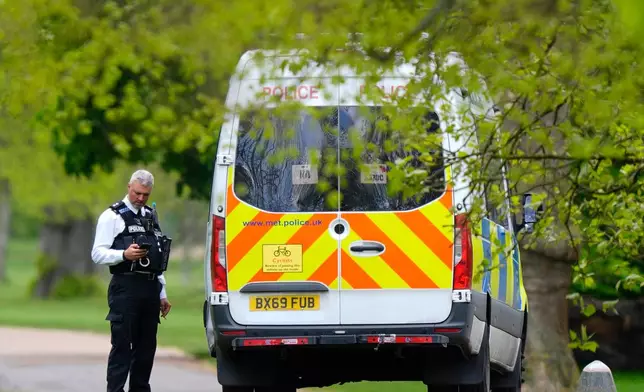 Police officers investigate in Kensington Gardens, central London, Friday April 17, 2026, as the whole of the park is cordoned off and has been closed since Friday morning, as police investigate whether items discarded near the Israeli embassy are linked to a video saying an attack on the embassy was planned. (Jordan Pettitt/PA via AP)