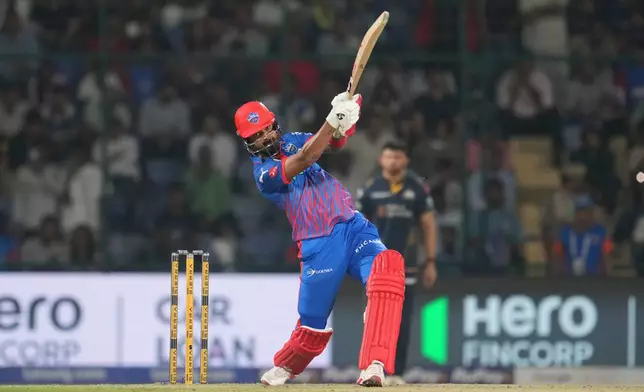 Delhi Capitals' KL Rahul hits a six during the Indian Premier League cricket match between Delhi Capitals and Gujarat Titans in New Delhi, India, Wednesday, April. 8, 2026. (AP Photo/ Manish Swarup)